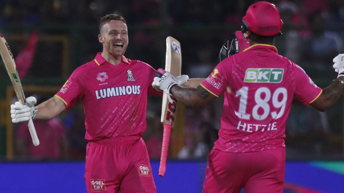 Jos Buttler responds to Shimron Hetmyer's enthusiastic celebration after scoring a century against RCB